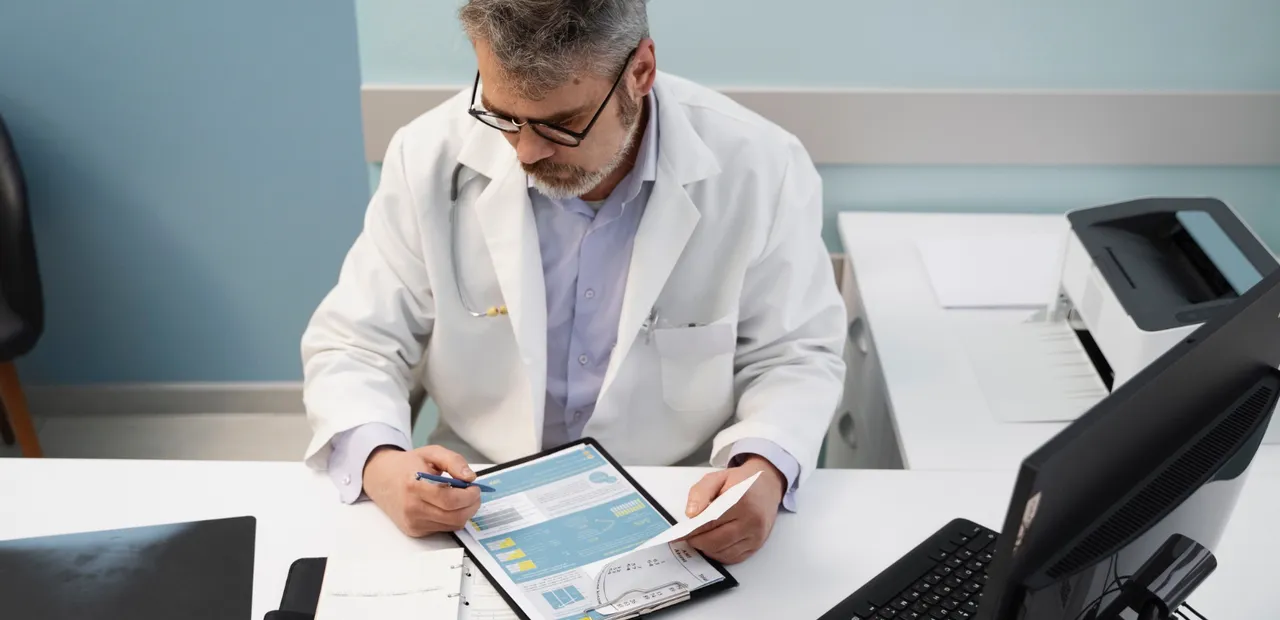 doctor speaking with elderly man